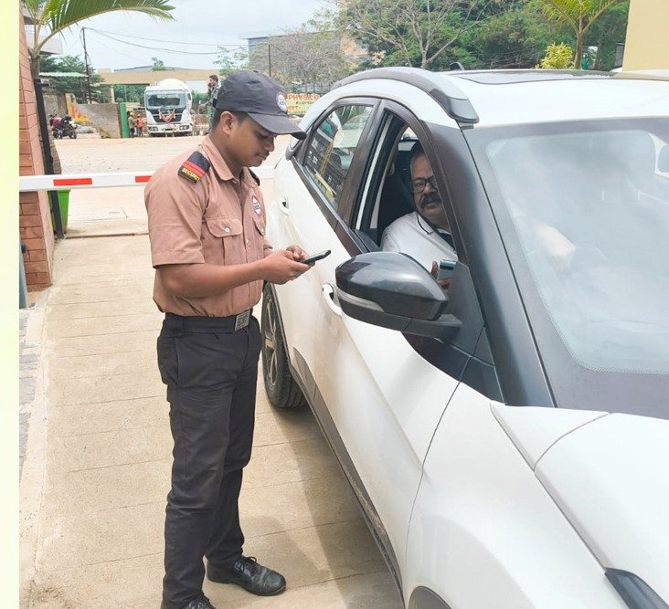 Eyespy security guard verifying a visitor's vehicle at a gate checkpoint